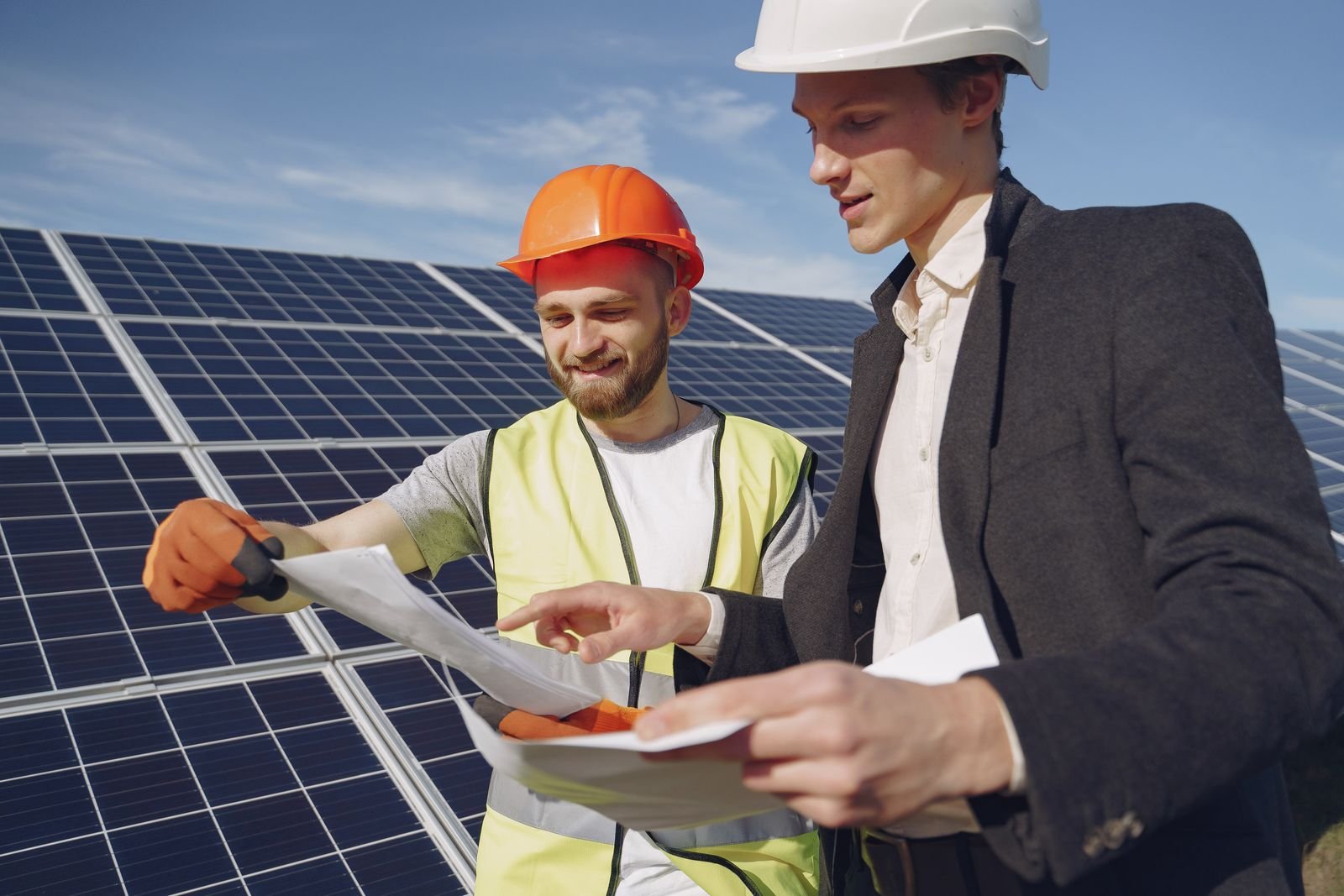 Engineers reviewing plans at a solar power installation in South Africa