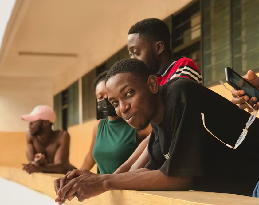 South African postgraduate students on a university campus balcony
