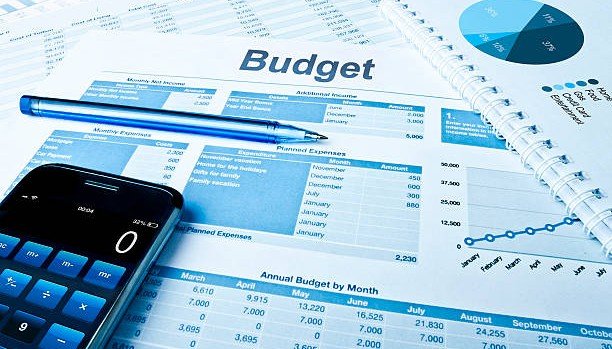 Calculator and budget statement representing the SASSA means test income check