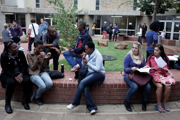 South African university students sitting together on campus